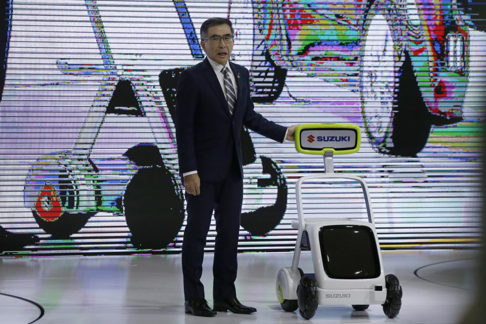 Toshihiro Suzuki, president of Suzuki Motor Corp., speaks during Suzuki's presentation of the media preview of the Tokyo Motor Show Wednesday, Oct. 23, 2019, in Tokyo. (AP Photo/Kiichiro Sato)