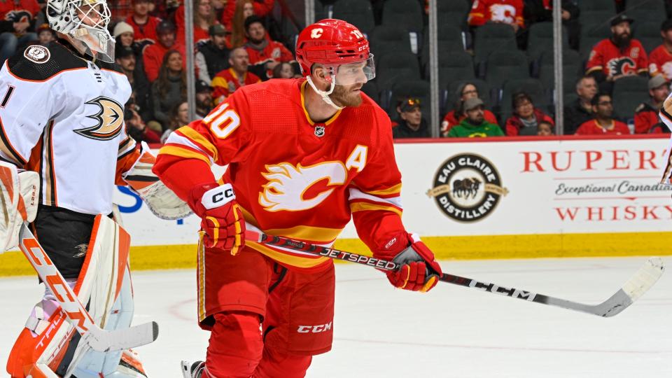 CALGARY, ALBERTA - APRIL 02: Jonathan Huberdeau #10 of the Calgary Flames skates against in front of Lukas Dostal #1 of the Anaheim Ducks at Scotiabank Saddledome on April 02, 2023 in Calgary, Alberta. (Photo by Terence Leung/NHLI via Getty Images)