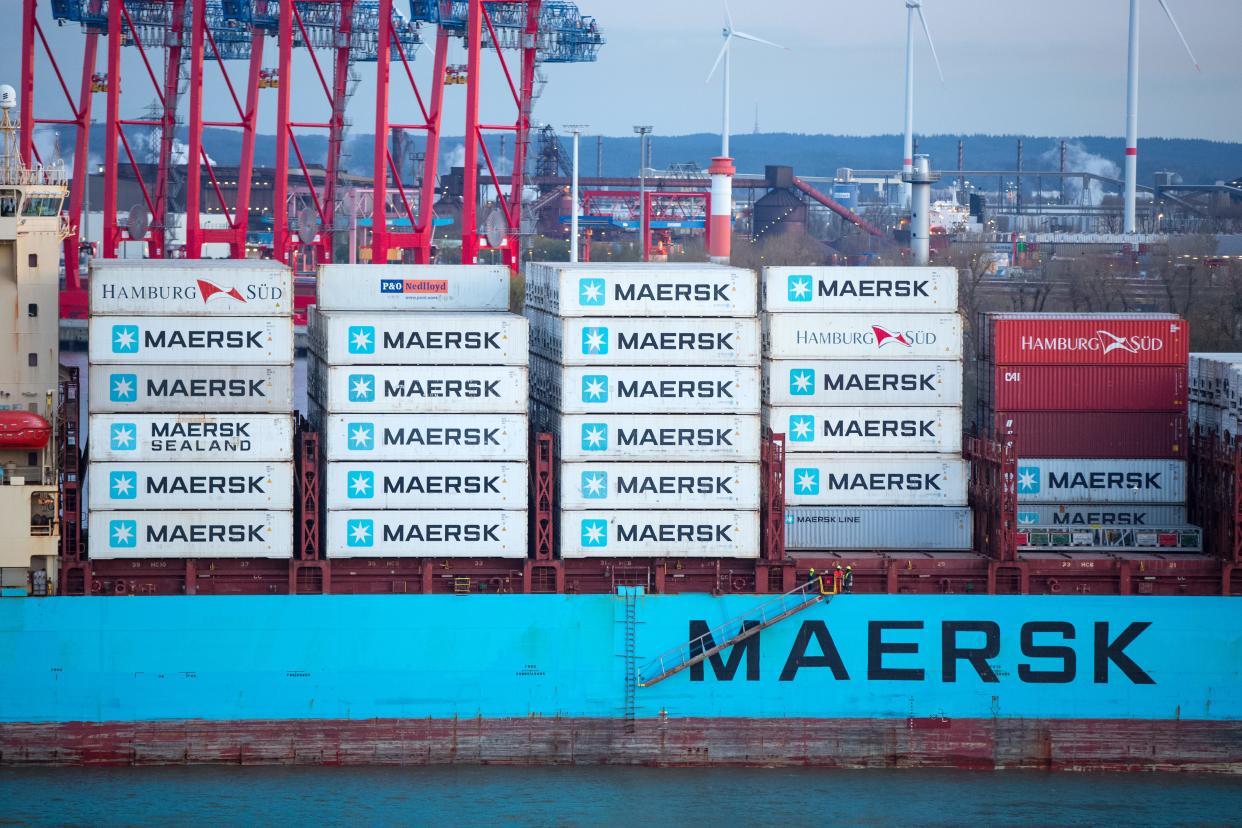 Maersk containers stacked on a ship.