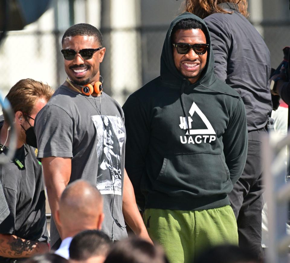 Michael B Jordan is all smiles as he directs "Creed III" directing a shirtless Jonathan Majors