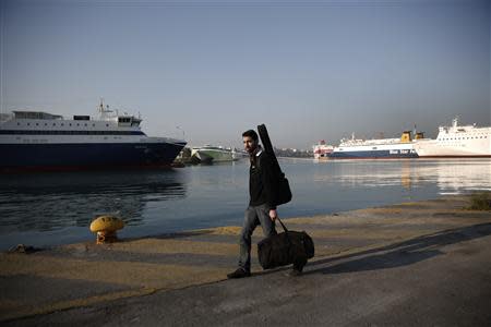 A passenger walks on a promenade during a general labour strike at Piraeus port, near Athens April 9, 2014. REUTERS/Yorgos Karahalis