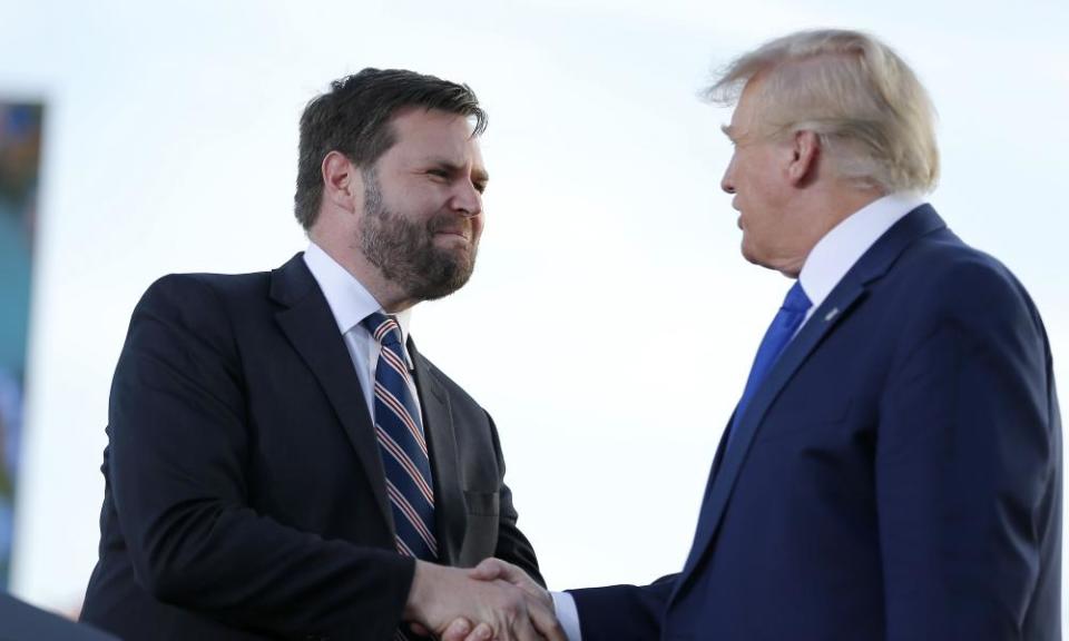 JD Vance greets Donald Trump at a rally in Delaware, Ohio, in April.