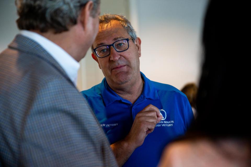 State senator Rodger Victory talks with voters after a forum for Holland-Area candidates Monday, June 20, 2022, at Boatwerks in Holland. 