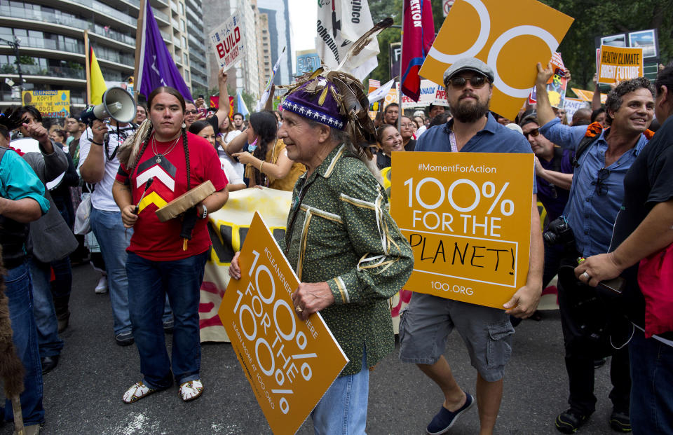 FILE - In this Sept. 21, 2014, file photo, Onondaga Nation Faithkeeper Oren Lyons, center, actor and activist Mark Ruffalo, far right, and actor Leonardo DiCaprio, center right, join participants during the People's Climate March in New York. When more than 100 world leaders descended on Rio de Janeiro in 1992 for an Earth Summit to discuss global warming and other environmental issues, there was "a huge feeling of well-being, of being able to do something. There was hope really," Lyons said. (AP Photo/Craig Ruttle, File)