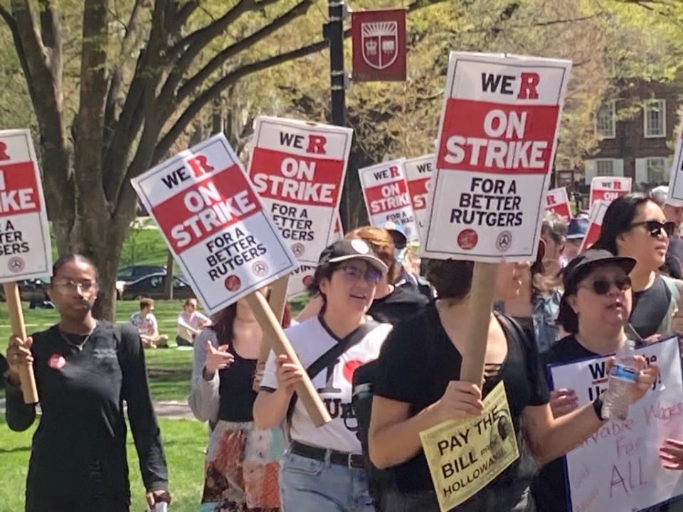 Three groups of picketers, many of them students holding makeshift drums and megaphones marched in circles on the shady green called Voorhees Mall on the New Brunswick Rutgers University campus chanting "when they say come back, we say fight back.”