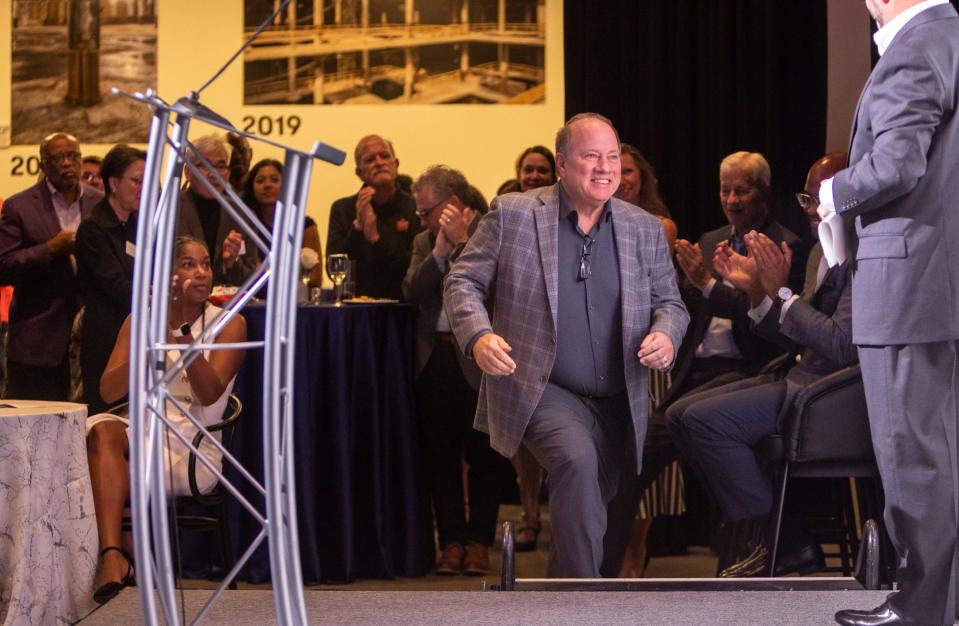 Mayor Mike Duggan walks on stage to speak in front of dozens of people inside the Newlab at Michigan Central in Detroit on Tuesday, Sept. 19, 2023. During the event, Duggan and other JPMorgan Chase employees celebrated its longstanding commitment to Detroit. 
