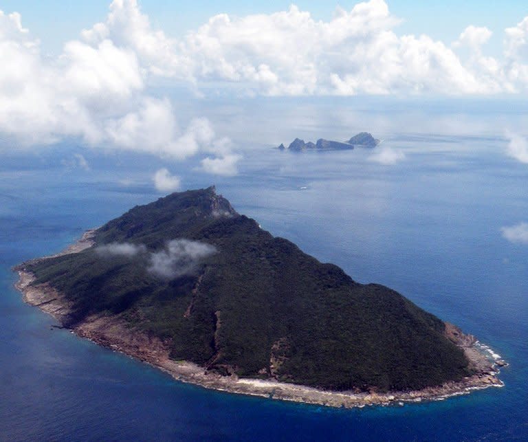 This file aerial shot, taken on September 15, 2010, shows the disputed islands, known as Senkaku in Japan and Diaoyu in China, in the East China Sea. A boat with Taiwanese activists who had intended to land on disputed Japanese-controlled islands returned home Thursday after coastguard vessels from the two sides converged and duelled with water cannon