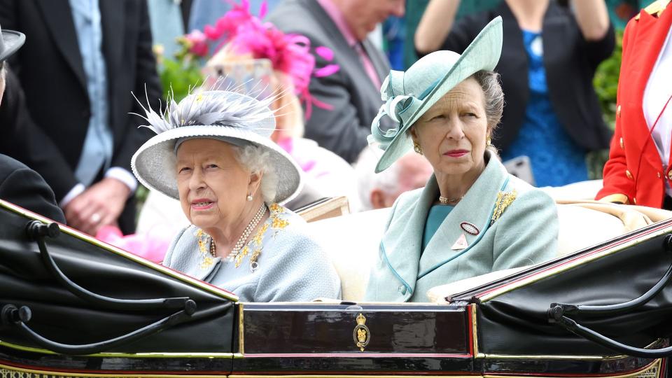 The Queen and Princess Anne riding in a carriage