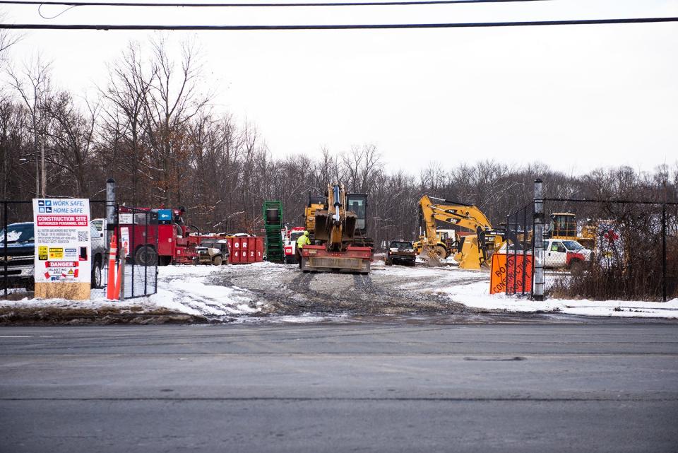 Construction workers use equipment at a construction site on Route 300 in Newburgh, on Jan. 7.