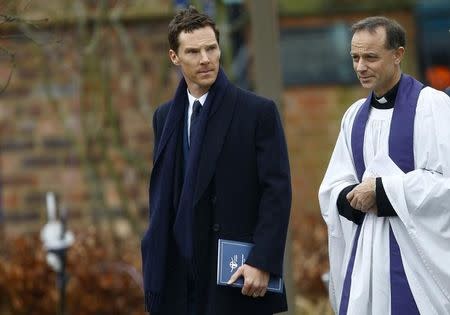 Actor Benedict Cumberbatch (L) arrives with Canon Michael Harrison for the reinterment service of King Richard III at Leicester Cathedral, central England, March 26, 2015. REUTERS/Darren Staples