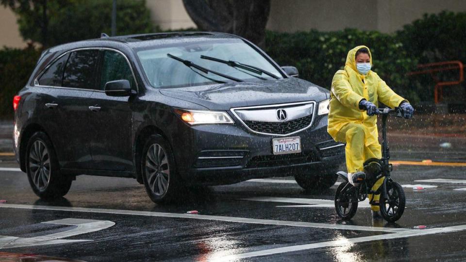 A cyclist waits for a traffic light to change near the San Luis Obispo County courthouse at the corner of Monterey and Santa Rosa streets on Tuesday, March 14, 2023. David Middlecamp/dmiddlecamp@thetribunenews.com