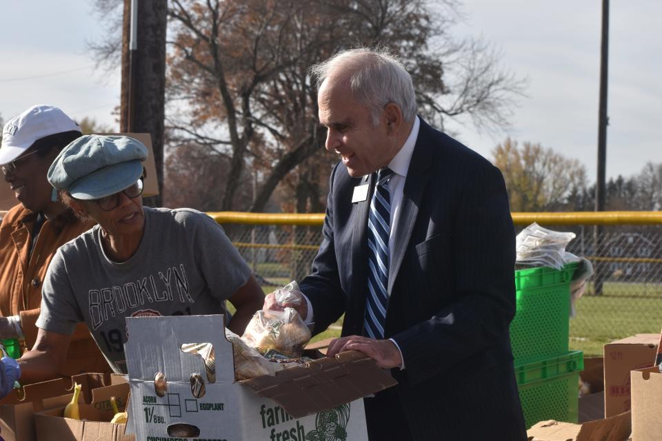 New York Assemblyman Jonathan Jacobson, D-Newborugh, helps distribute hundreds of pounds of produce at Fareground's annual pre-Thanksgiving food distribution in Beacon on Saturday, Nov. 17.