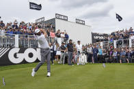 Dustin Johnson of the United States plays from the first tee during the first round of the inaugural LIV Golf Invitational at the Centurion Club in St. Albans, England, Thursday, June 9, 2022. (AP Photo/Alastair Grant)