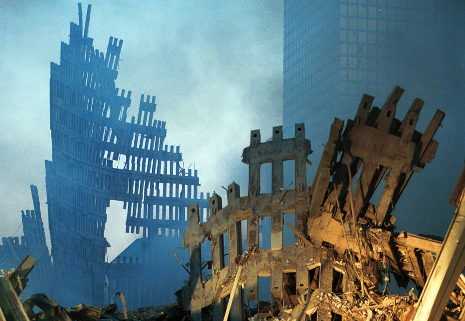 Image: Early morning light hits the smoke and wreckage of the World Trade Center on Sept. 13, 2001. (Chris Hondros / Getty Images file)