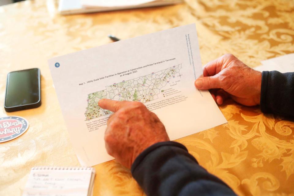 Chuck Brady explains a map of Tennessee showing where all of the solar plant farms are as residents gather to discuss why they are opposed to a solar farm being built in their neighborhood and listed the track record of how these things go when the company is not longer observing the solar farm at one of the resident’s home on Friday, Jan. 26, 2024 in Millington, Tenn.