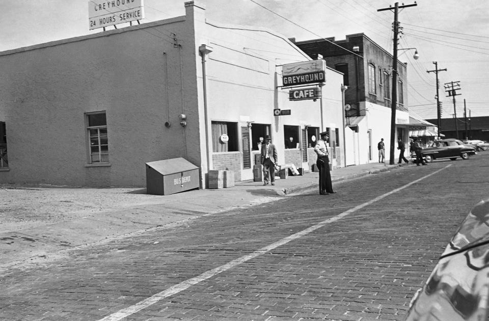 A city policeman stands in front of the bus station in McComb, Miss., Dec. 1, 1961, as a busload of "Freedom Riders" was expected to arrive and test the racial barriers at the bus station. Several Blacks were beaten when they tried to get lunch counter service at the station.