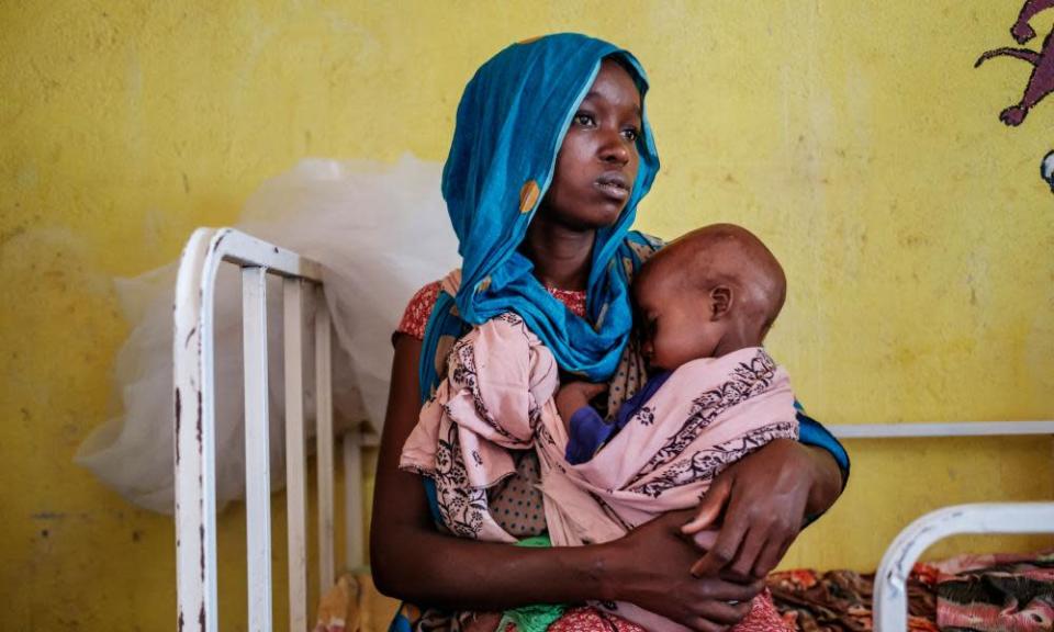 A woman holding a malnourished child in Kelafo, eastern Ethiopia, last month