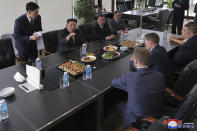 In this photo provided by the North Korean government, North Korea leader Kim Jong Un, second left, meets the officials of the Arnika Bio-Feed Mill at the mill in Vladivostok, Russian Far East Sunday, Sept. 17, 2023. Independent journalists were not given access to cover the event depicted in this image distributed by the North Korean government. The content of this image is as provided and cannot be independently verified. Korean language watermark on image as provided by source reads: "KCNA" which is the abbreviation for Korean Central News Agency. (Korean Central News Agency/Korea News Service via AP)