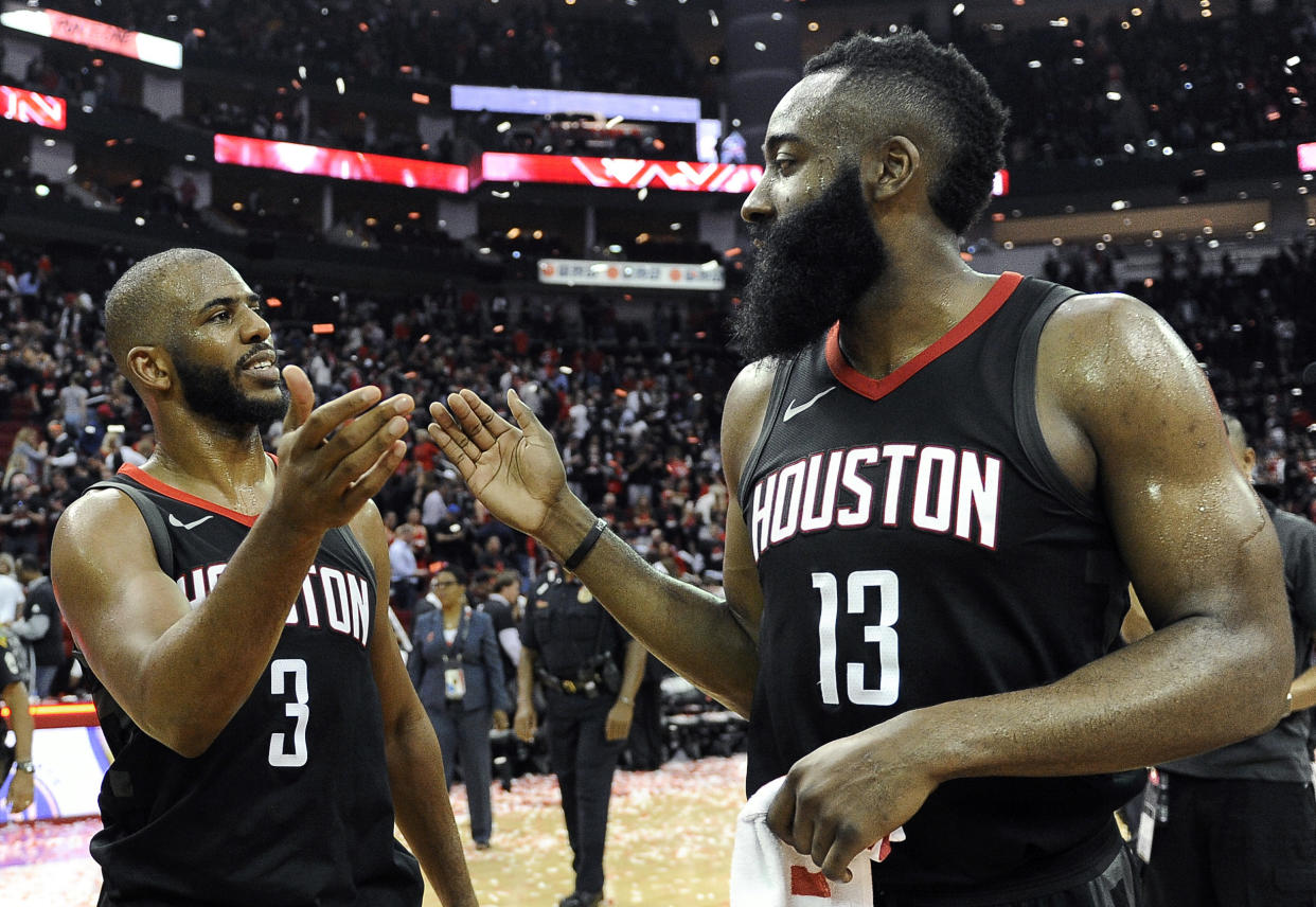 Houston Rockets guard Chris Paul (3) and James Harden celebrate the team’s win over the Utah Jazz during Game 5 of an NBA basketball second-round playoff series, Tuesday, May 8, 2018, in Houston. (AP Photo/Eric Christian Smith)