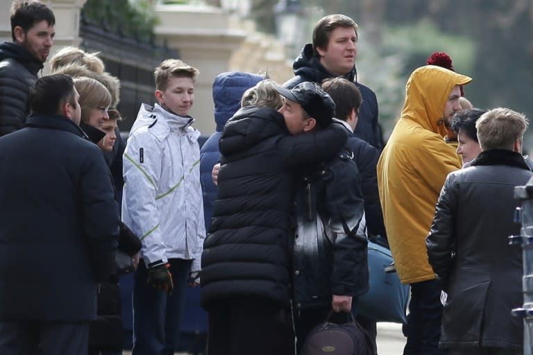 Some diplomats were seen holding pet carriers as they made their way to the three cars, five people carriers and two small coaches waiting