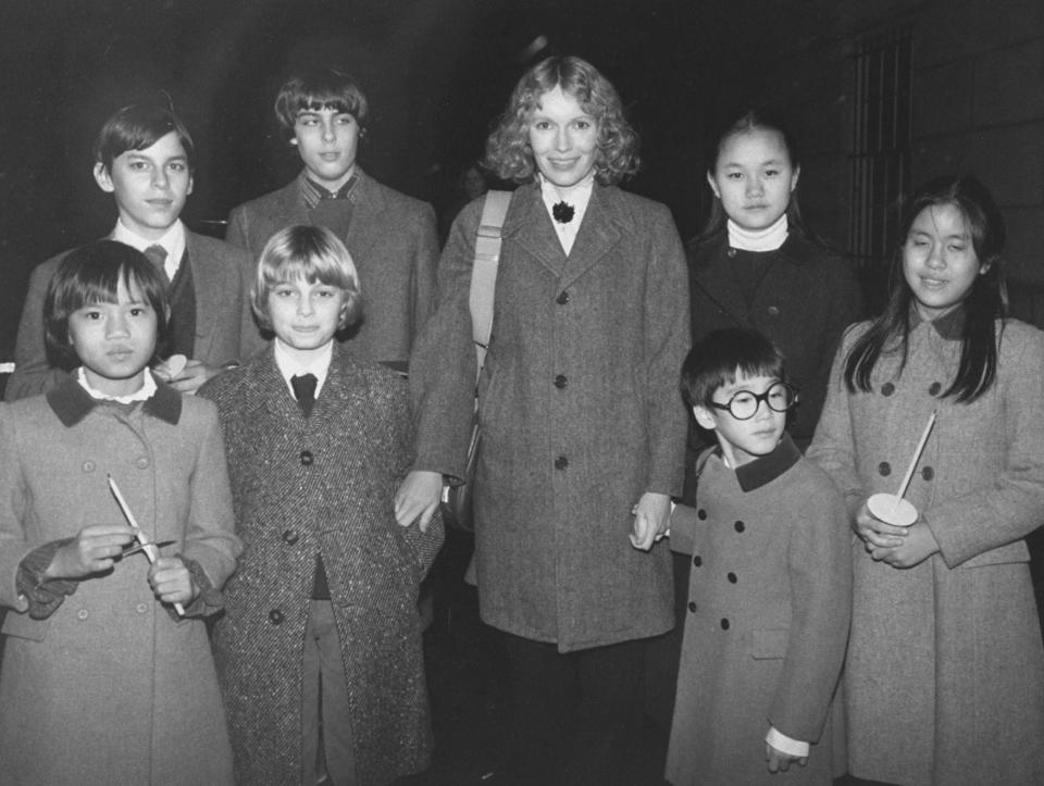 Actress Mia Farrow with her children (back row) Matthew, Sascha, Soon-Yi; (front row) Daisy, Fletcher, Moses and Lark.&nbsp;Moses Farrow&nbsp;wrote a scathing essay accusing&nbsp;his mom of repeated physical abuse. (Photo: David McGough via Getty Images)