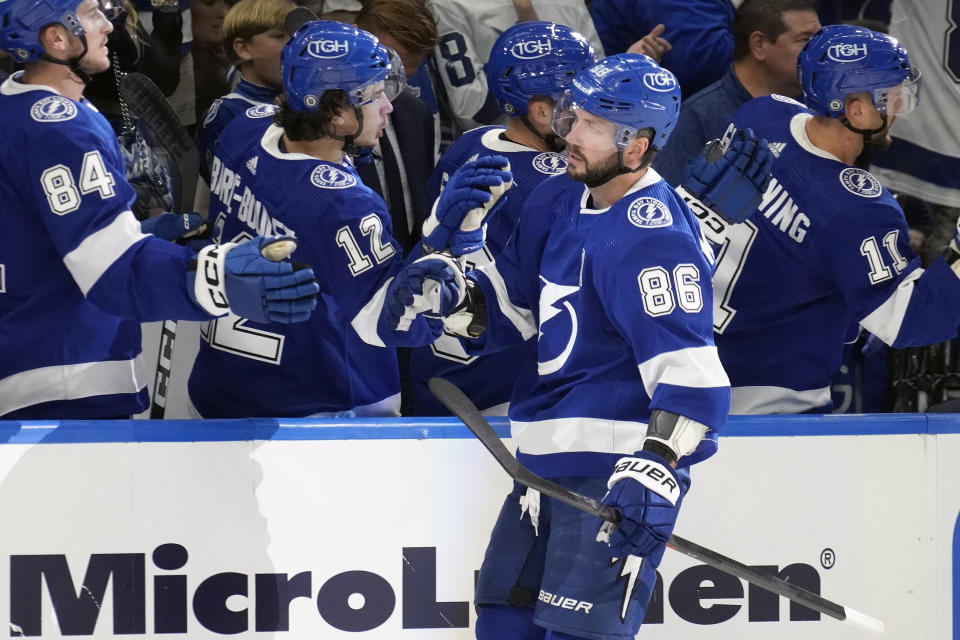 Tampa Bay Lightning right wing Nikita Kucherov (86) celebrates with the bench after his goal against the Toronto Maple Leafs during the first period of an NHL hockey game Saturday, Oct. 21, 2023, in Tampa, Fla. (AP Photo/Chris O'Meara)