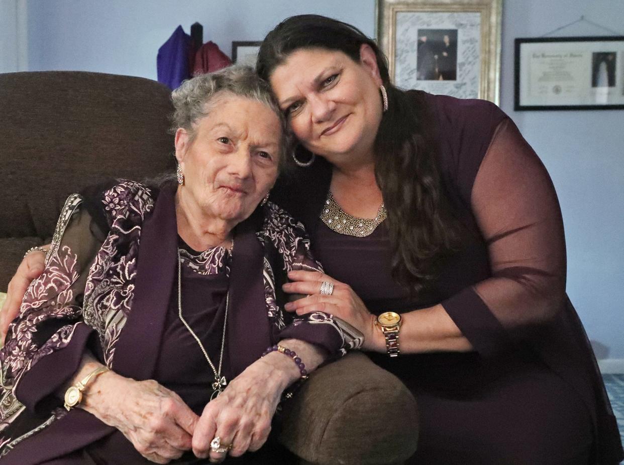 Eva Mae Brown, who turns 93 on Mother's Day, and her daughter Angela Brown who shares a birthday with her mother pose in the living room of their home in Cuyahoga Falls on Friday, May 3, 2024.