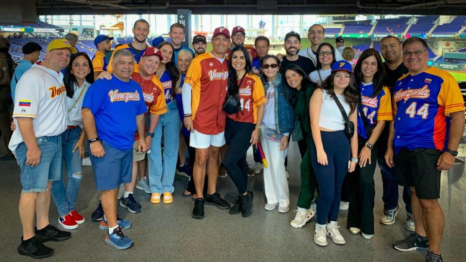 Friends and family of Miami Marlins pitcher Jesus Luzardo, including dad Jesus Luzardo Sr. and mom Monica Luzardo (center), pose for a photo before Venezuela plays Israel in the World Baseball Classic on Wednesday, March 15, 2023, at loanDepot park in Miami, Florida.