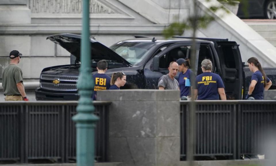 Authorities investigate a pickup truck parked on the sidewalk in front of the Library of Congress in Washington last month.