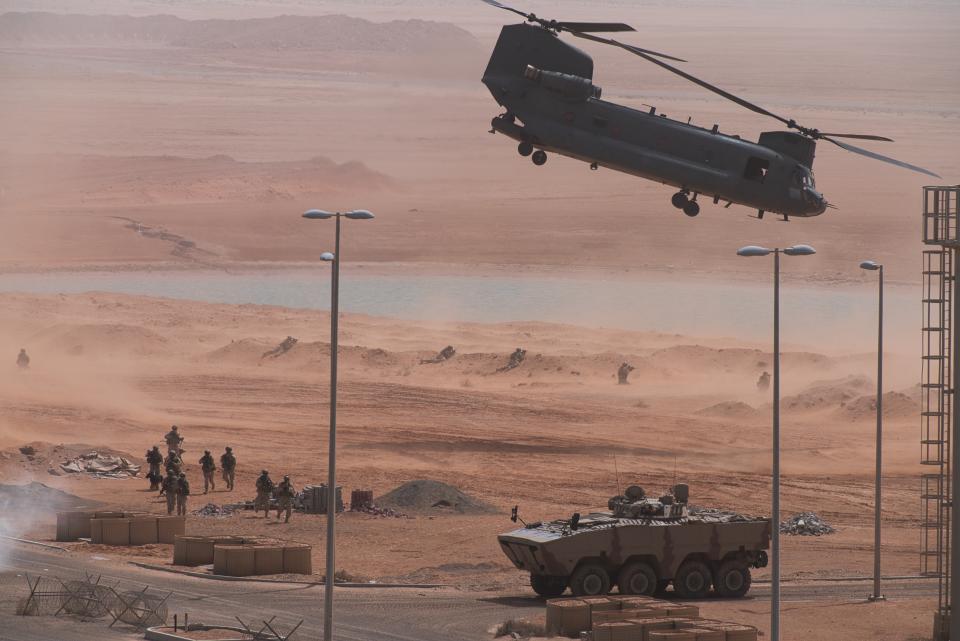 An Emirati Boeing CH-47 Chinook takes off during an exercise at an Emirati military base home to a Military Operations in Urban Terrain facility in al-Hamra, United Arab Emirates, Monday, March 23, 2020. The U.S. military held the major exercise Monday with Emirati troops in the UAE's far western desert at a facility designed to look like a Mideast city amid ongoing tensions with Iran. (AP Photo/Jon Gambrell)