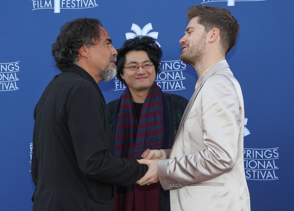 From left, Alejandro Inarritu, Davy Chou, and Lukas Dhont chat while attending a panel discussion at the Camelot Theatre in Palm Springs, Calif., Jan. 11, 2023.