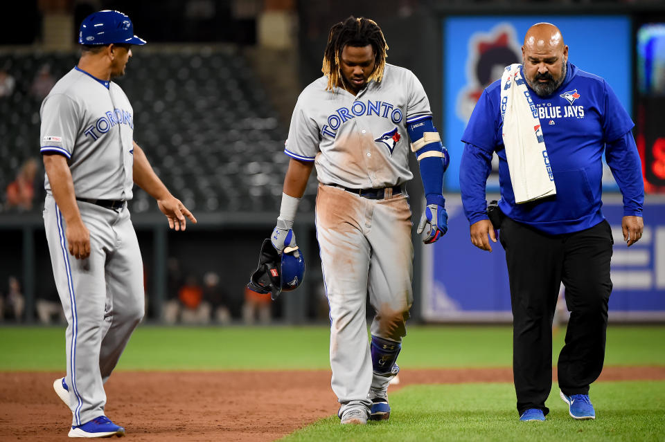 BALTIMORE, MD - SEPTEMBER 18: Vladimir Guerrero Jr. #27 of the Toronto Blue Jays walks off the field after an apparent injury during the ninth inning against the Baltimore Orioles at Oriole Park at Camden Yards on September 18, 2019 in Baltimore, Maryland. (Photo by Will Newton/Getty Images)