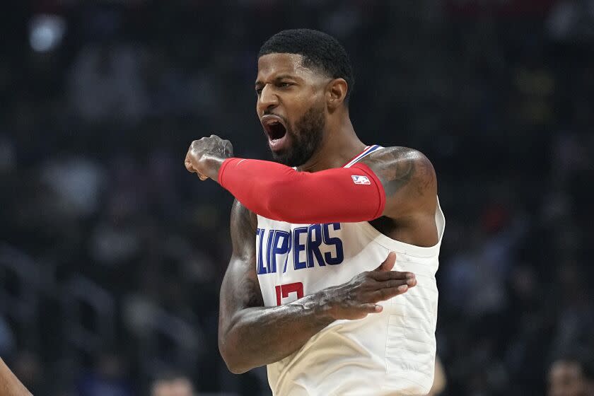 Los Angeles Clippers guard Paul George celebrates after scoring during the first half.