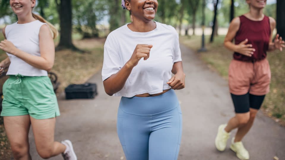 Exercise such as running with a group helps you to be more social and to build relationships with others. - South_agency/E+/Getty Images