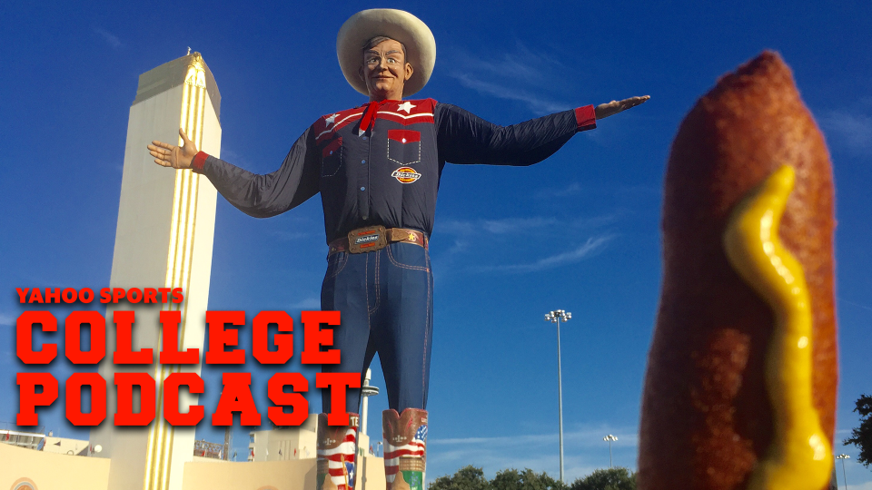 DALLAS, TX - OCTOBER 6: Fairgoers gather at Big Tex at the State Fair of Texas, home to the Red River Showdown football game between Texas and Oklahoma at the Cotton Bowl October 6, 2018 in Dallas, Texas.