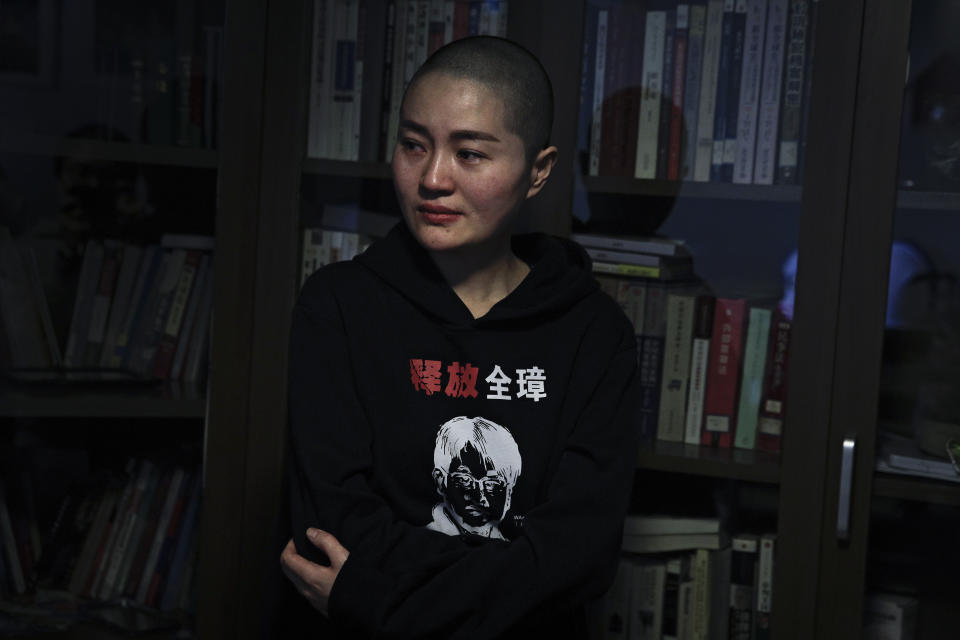 Li Wenzu, wife of prominent Chinese human rights lawyer Wang Quanzhang wears a sweater with her husband's portrait printed with the words "Release Quanzhang" after Wang's sentencing, at her house in Beijing, Monday, Jan. 28, 2019. Wang was sentenced to 4 and half years in prison on the charge of subversion of state power Monday, more than three years after he was detained in a wide-ranging crackdown on the legal profession. (AP Photo/Andy Wong)