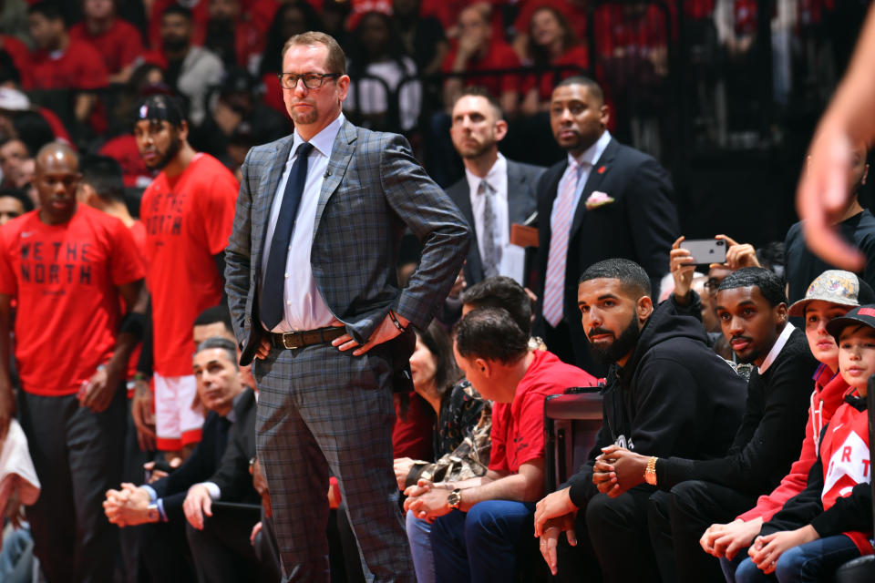 TORONTO, CANADA - MAY 25: Head Coach, Nick Nurse of the Toronto Raptors and Rapper, Drake, look on during a game between the Milwaukee Bucks and the Toronto Raptors during Game Six of the Eastern Conference Finals on May 25, 2019 at Scotiabank Arena in Toronto, Ontario, Canada. NOTE TO USER: User expressly acknowledges and agrees that, by downloading and/or using this photograph, user is consenting to the terms and conditions of the Getty Images License Agreement. Mandatory Copyright Notice: Copyright 2019 NBAE (Photo by Jesse D. Garrabrant/NBAE via Getty Images)