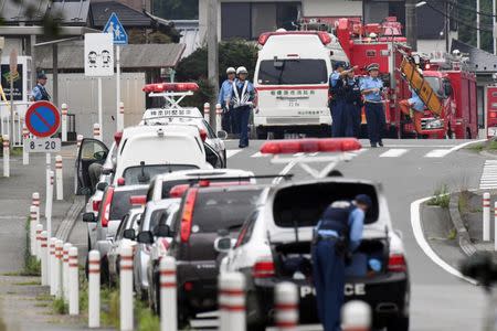 Police officers are seen near a facility for the disabled where at least 19 people were killed and as many as 20 wounded by a knife-wielding man, in Sagamihara, Kanagawa prefecture, Japan, in this photo taken by Kyodo July 26, 2016. Mandatory credit Kyodo/via REUTERS.