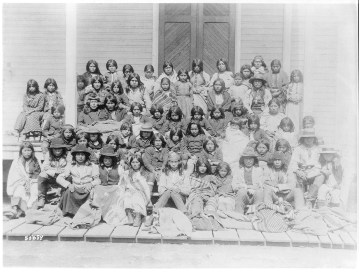 Ciricahua Apaches at the Carlisle Indian School, Penna., 188-?: as they looked upon arrival at the School (Library of Congress)