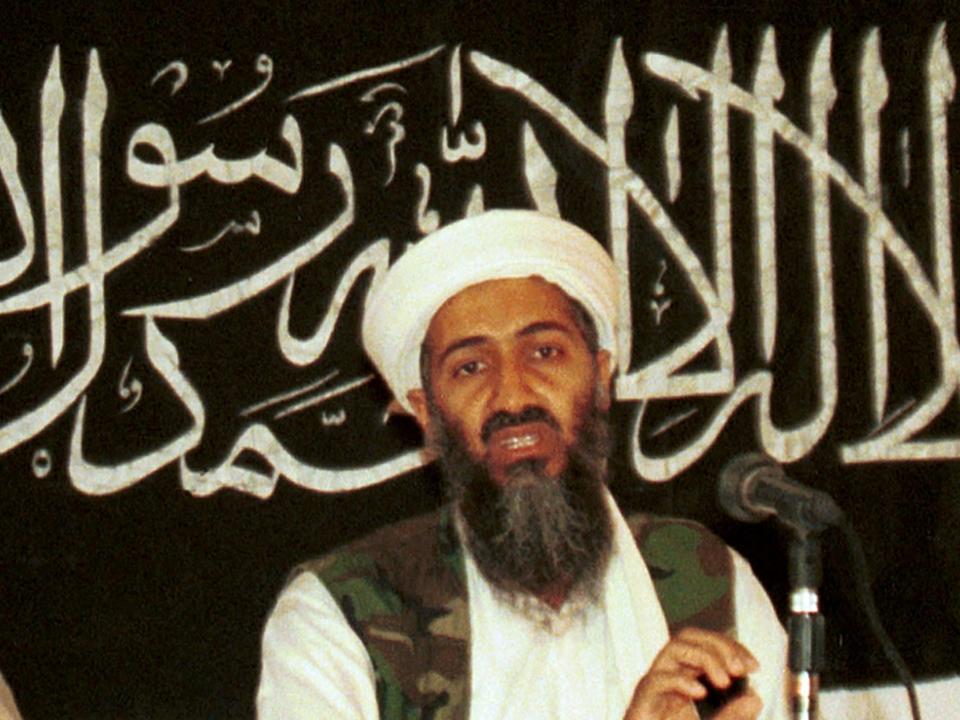Osama bin Laden stands at a news conference.