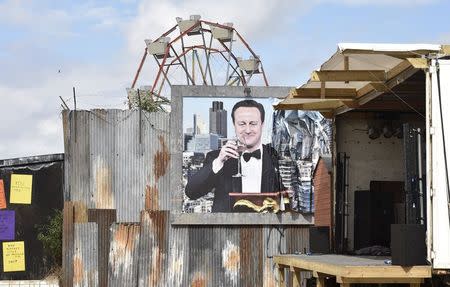 A poster is pictured at 'Dismaland', a theme park-styled art installation by British artist Banksy, at Weston-Super-Mare in southwest England, Britain, August 20, 2015. REUTERS/Toby Melville