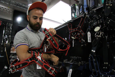 Syrian migrant Haidar Darwish works at Brunos shop in Berlin, Germany, July 24, 2018. REUTERS/Alessia Cocca