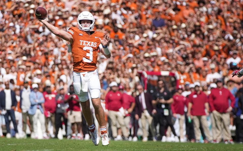 Quarterback Quinn Ewers passes for a touchdown against Oklahoma on Oct. 7. Ewers has completed 69.5% of his passes for 1,704 yards and 11 touchdowns and has run for 140 positive yards and five scores.