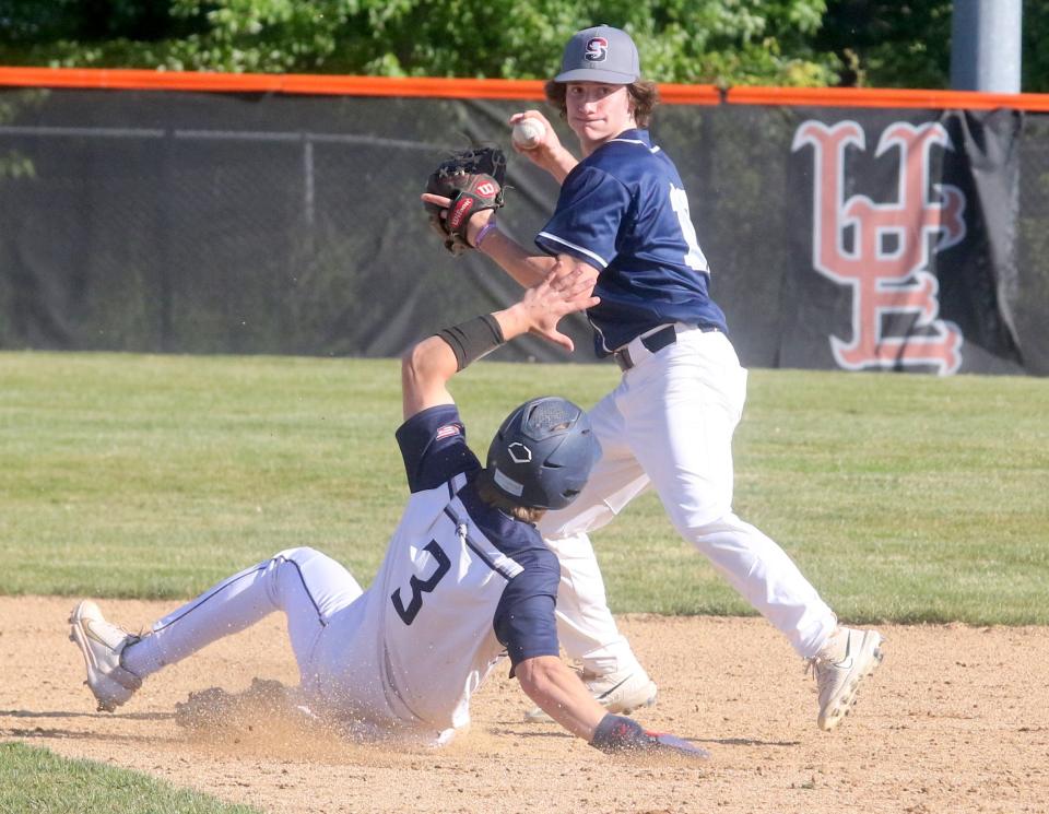 Watkins Glen/Odessa-Montour second baseman Brad Gillis throws to first after forcing out Bainbridge-Guilford's Connor Davy at second base in a 6-4 victory in the Section 4 Class C baseball championship game May 26, 2023 at Union-Endicott High School.