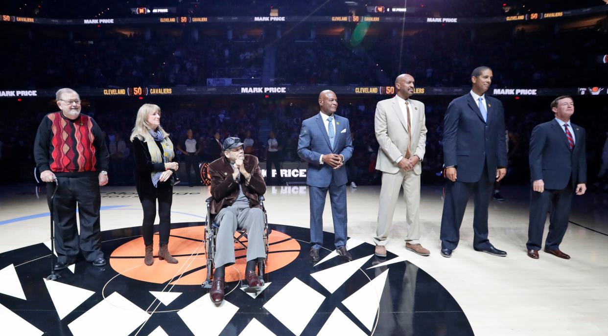 Cavs play-by-play legend Joe Tait, left, is joined by Marci Thurmond, wife of Nate Thurmond, and former Cavs Bingo Smith, Austin Carr, Larry Nance, Brad Daugherty and Mark Price during a pregame ceremony, Saturday, Oct. 26, 2019, in Cleveland.