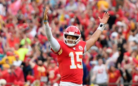 Kansas City Chiefs quarterback Patrick Mahomes (15) celebrates a touchdown by running back Darwin Thompson during the second half of an NFL football game against the Baltimore Ravens in Kansas City - Credit: AP