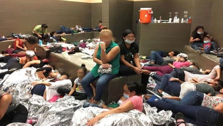 An overcrowded area holding families at a Border Patrol station is seen in Weslaco