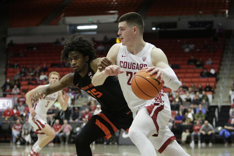 FILE - Washington State forward Andrej Jakimovski, right, drives while defended by Oregon State forward Glenn Taylor Jr. during the first half of an NCAA college basketball game Feb. 16, 2023, in Pullman, Wash. Jakimovski is one of two primary returning scorers for the Cougars after significant changes to the roster following last season. (AP Photo/Young Kwak, File)