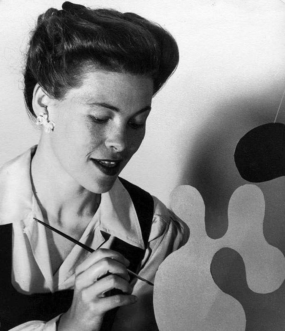 Sacramento-born designer and artist Ray Eames works in her studio.