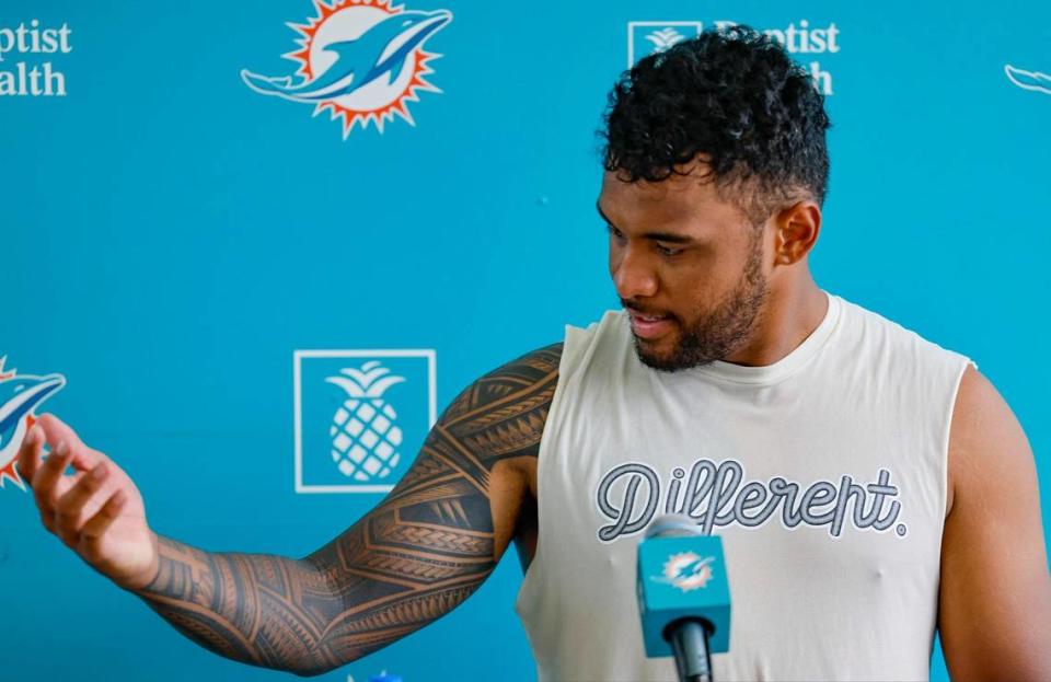 Miami Dolphins quarterback Tua Tagovailoa (1) talks about his completed tattoo during a press conference after practice at the Baptist Health Training Complex in Miami Gardens, Florida on Wednesday, July 26, 2023.